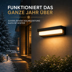 Solar Wandleuchte rechteckig mit Acryl-Diffusor schwarz (Norlyn), im Winter bei Schnee