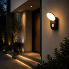 LED Außenwandleuchte mit Bewegungsmelder oval schwarz (Ali), am Hauseingang