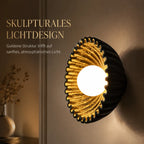 Wandleuchte Muschel-Design schwarz-gold (Solvaria), Lichtwirkung an der Wand