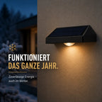 Solar Wandleuchte mit LED-Spots keilförmig schwarz (Velmora), im Winter bei Schnee